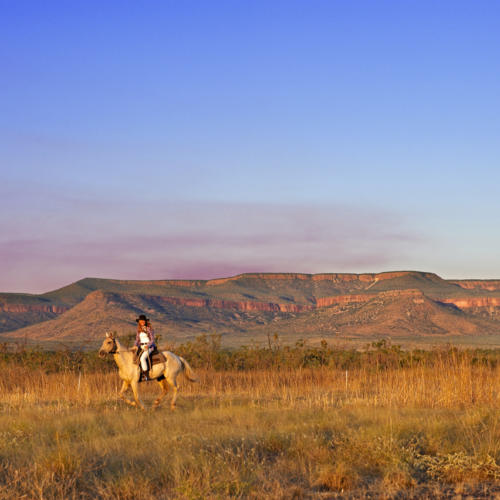 Couple riding on Home Valley Station, located west of Kununurra