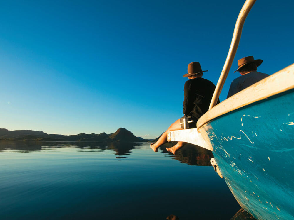Couple sitting on boat on Lake Argyle